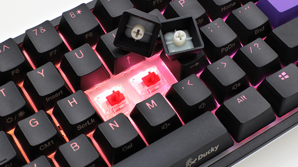 Ducky One 2 Mini 60 Keyboard with middle two arrow keys removed to reveal red backlight
