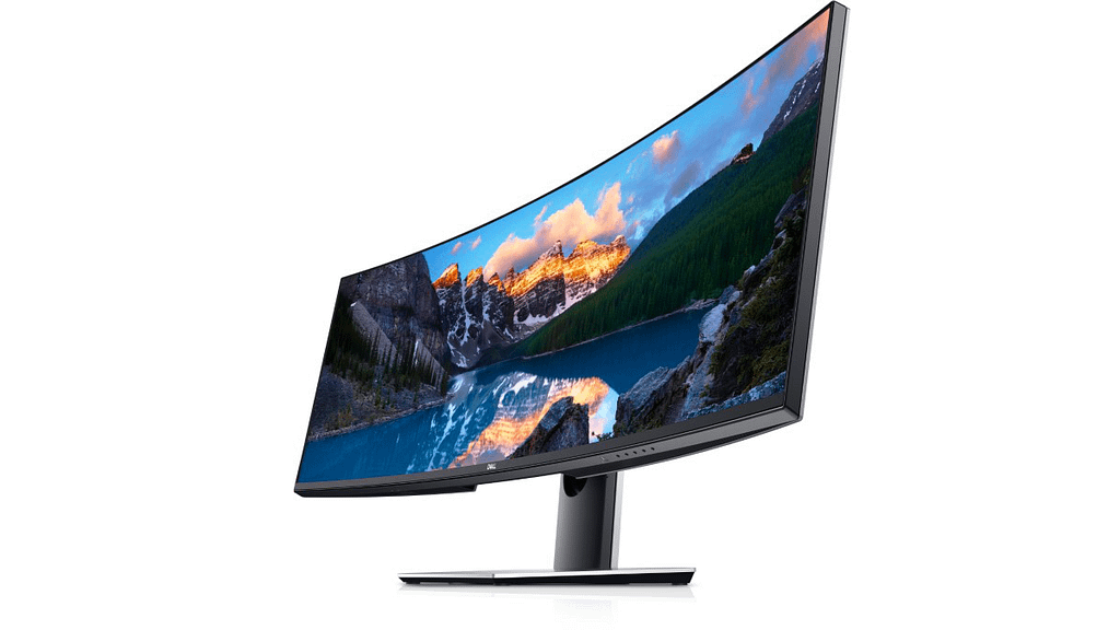 Side on profile of the Dell Ultrasharp U4919DW showing a vibrantly colorful natural background