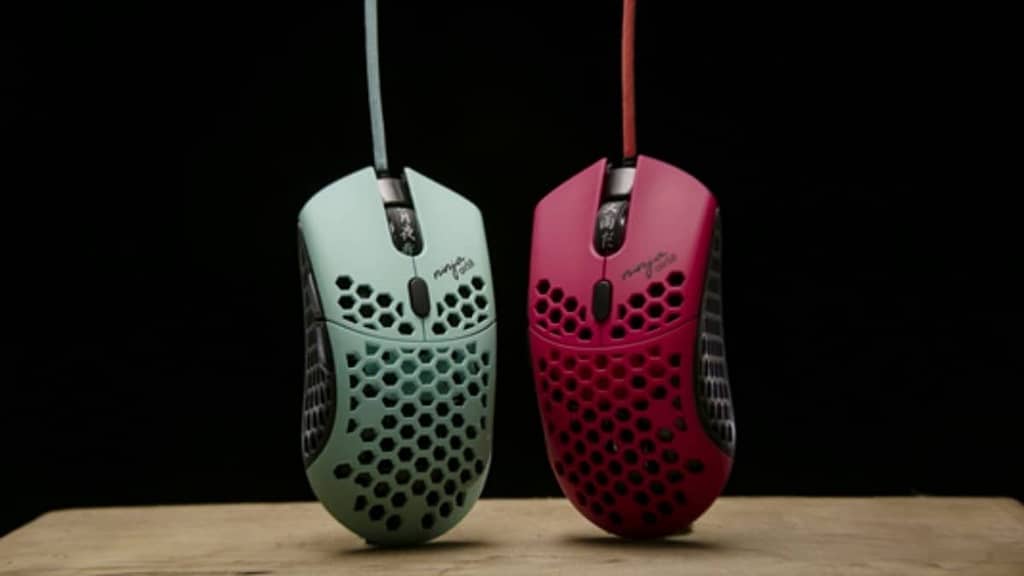 The FinalMouse Air58 Ninja in Cherry Blossom Blue and Cherry Blossom Pink, both in front of a black background